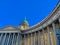 The photo shows part of the church and the columns of the main entrance to St. Isaac's Cathedral in St. Petersburg.