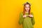 Photo of shy red hairdo young lady book on head look empty space wear green sweater spectacles isolated on yellow color