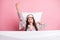 Photo of sleepy pretty woman sleepwear mask lying pillow covering duvet stretching yawning isolated pink color