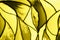 Photo of a small fragment of a beautiful stained glass toned in trendy yellow color. Mockup for your design. Trendy background.