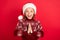 Photo of small girl happy positive smile hands wait wish gift holiday new year isolated over red color background