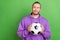 Photo of smart guy leader trainer hold soccer ball imagine world cup win wear jumper sweater isolated over green color