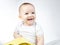 Photo of smiling eleven-month-old baby on a white background