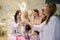 Photo of smiling females drinking champagne at a bachelorette party in spa salon