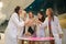 Photo of smiling females drinking champagne at a bachelorette party in spa salon