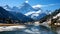 A photo of snow-capped peaks, with pristine alpine lakes as the background, during the winter season