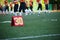 Photo of soccer field with number thirty running football players on blurred background