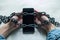 Photo Social media shackles Mobile phone symbolically chained to users hands