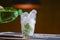 Photo of soda being poured into a glass with ice cubes and mint ina bar. Bar, cafe or restaurant photo concept.