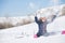 Photo of sports woman sitting in snowdrift, snow-throwing