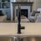 Photo Square Undermount sink with double bowl and black faucet at the kitchen island of home