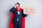 Photo of stressed troubled beggar mature dismissed business guy super hero character costume hold carton placard need