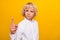 Photo of strict confident schoolboy raise finger punish wear school uniform isolated yellow color background