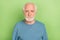 Photo of strict elder beard man wear blue sweater isolated on green color background