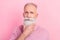 Photo of strict grey hair senior man hand chin wear pink sweater isolated on pastel color background