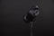 Photo studio strobe light flash bulb. Close up view of professional studio strobe flash lamp on black background