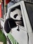 A photo of a stuffed panda sitting on driver seat