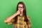 Photo of stunned young girl finger touch fixing glasses look camera facial reaction isolated on green color background