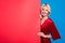 Photo of stunning luxury lady wear red shiny dress smiling holding empty space isolated blue color background