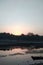Photo of the sun setting with the lake in the city of India