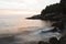 Photo of sundown at the beach in montenegro. Waves in the motion in foreground. Ulcinj.