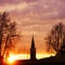 photo of the sunrise behind a bell tower, photo taken in Mogliano Veneto, Italy