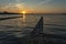 A photo during sunset of the quay walls of a bridge in the water of lake Zoetermeerse Plas