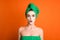 Photo surprised funny lady wear green towel head mask face isolated orange color background