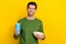 Photo of sweet charming guy dressed green pullover holding popcorn soda cup isolated yellow color background