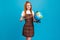 Photo of sweet charming orange hair lady wear plaid overall spectacles pointing globe smiling isolated blue color