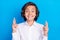 Photo of sweet charming school boy wear formal outfit smiling fingers crossed  blue color background