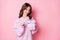 Photo of sweet charming young lady wear knitted pullover open gift empty space  pastel pink color background