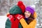 Photo of sweet cute girlfriend boyfriend dressed vests smiling embracing smiling enjoying walking snow outdoors forest