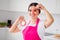 Photo of sweet funny mature woman dressed pink apron smiling red pepper slice cover eye cooking lunch indoors house home