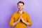 Photo of sweet handsome young gentleman dressed yellow shirt smiling showing arms roof  violet color background