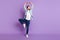 Photo of sweet handsome young guy dressed denim shirt dancing looking empty space  purple color background