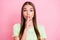 Photo of sweet pretty young girl dressed green t-shirt finger lips ask not tell secrets isolated pastel pink color