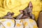 Photo of a sweetly sleeping cat in a yellow bright coat. Cat of the Sphynx breed is wrapped in a rug and sleeps