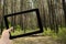 Photo tablet PC in hand in alley footpath in forest