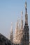 Photo taken high up in the terraces of Milan Cathedral / Duomo di Milano, showing the gothic architecture in detail.