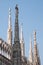 Photo taken high up in the terraces of Milan Cathedral / Duomo di Milano, showing the gothic architecture in detail.