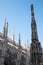 Photo taken high up in the terraces of Milan Cathedral / Duomo di Milano, showing the gothic architecture in detail.
