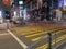 A photo taken with a slow shutter speed of pedestrians crossing at Queen`s Road Central in