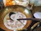 A photo is Taro in sweet coconut milk. It is Thai dessert. Toro soup is cooking in bronze pan.