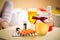 Photo of tea, honey jar and pills lying on table at bedroom