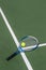 Photo of tennis racket tennis ball on court background.