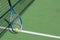 Photo of tennis racket tennis ball on court background.