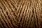 A photo of a texture of a coil of natural hemp rope.