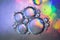 Photo textured holographic bubbles on colorful background