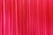 Photo Theatrical curtain of scarlet color of velvet.